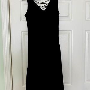 Black crepe midi cocktail dress with asymmetrical hem.